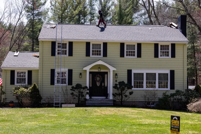 Ice dam damage repair on a roof in Dracut, MA