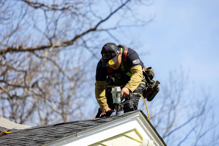 Vinyl siding and seamless gutter installation on a home in Reading, MA