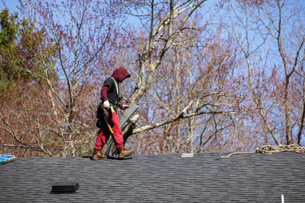Senco crew installing a new replacement window on a home in Tewksbury, MA