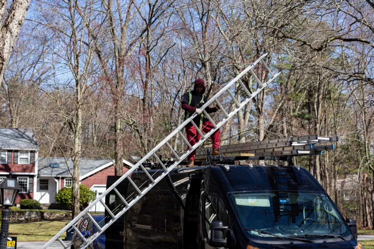 Seamless aluminum gutter installation on a home in Tewksbury, MA